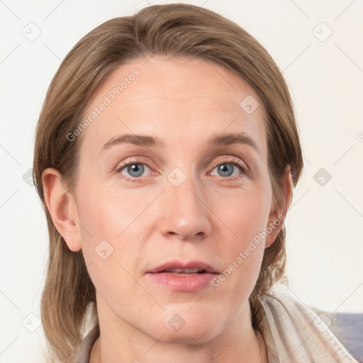 Joyful white adult female with medium  brown hair and grey eyes