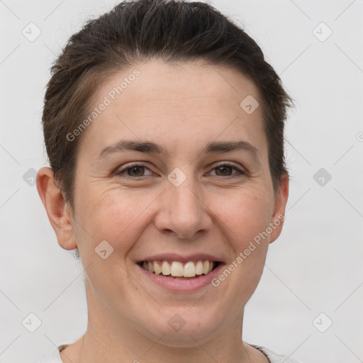 Joyful white adult female with short  brown hair and brown eyes