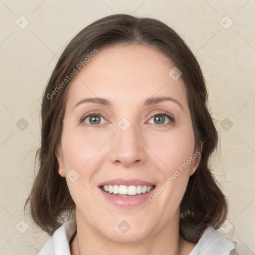 Joyful white young-adult female with medium  brown hair and green eyes