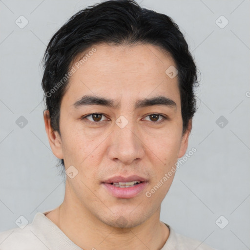 Joyful asian young-adult male with short  black hair and brown eyes