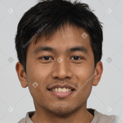 Joyful asian young-adult male with short  brown hair and brown eyes