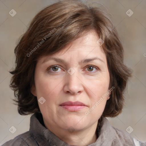 Joyful white adult female with medium  brown hair and grey eyes