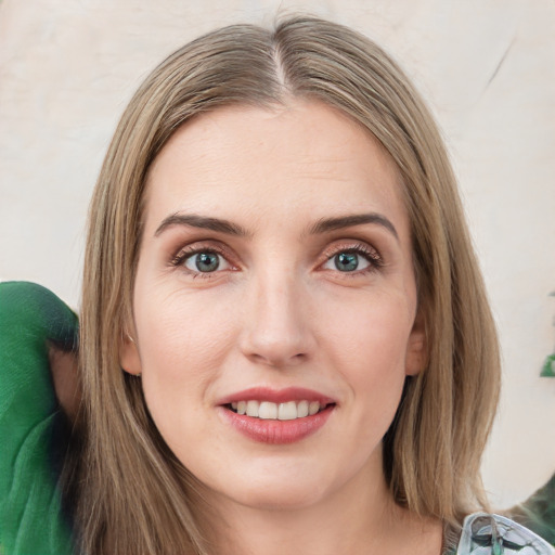 Joyful white young-adult female with medium  brown hair and green eyes