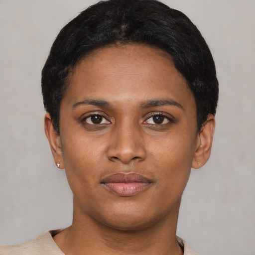 Joyful latino young-adult female with short  black hair and brown eyes