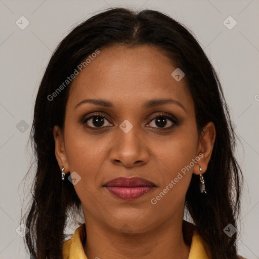 Joyful black young-adult female with long  brown hair and brown eyes