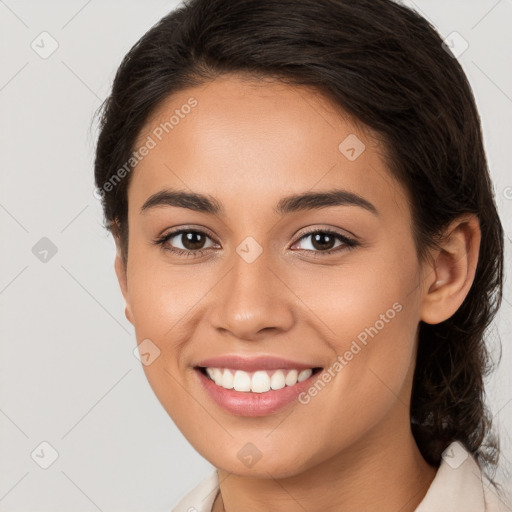 Joyful white young-adult female with long  brown hair and brown eyes