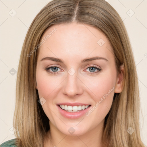 Joyful white young-adult female with long  brown hair and green eyes