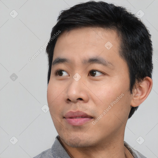 Neutral asian young-adult male with short  black hair and brown eyes