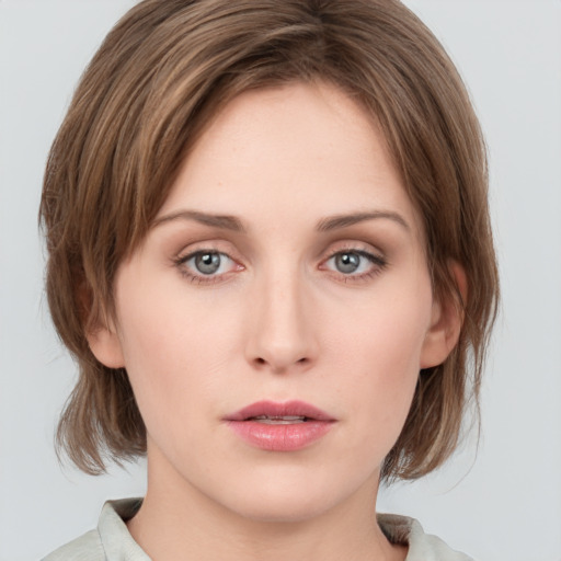 Neutral white young-adult female with medium  brown hair and green eyes