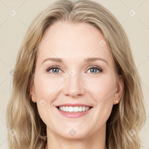 Joyful white young-adult female with long  brown hair and blue eyes