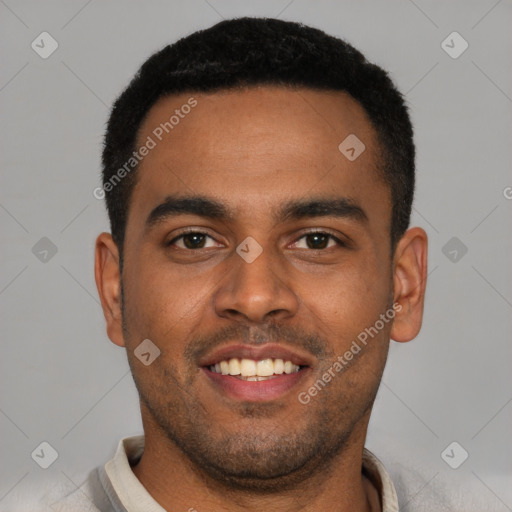 Joyful black young-adult male with short  black hair and brown eyes