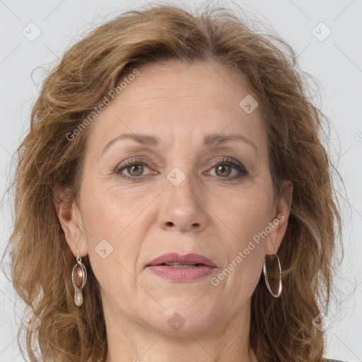 Joyful white adult female with long  brown hair and grey eyes