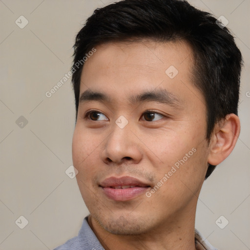 Joyful white young-adult male with short  black hair and brown eyes