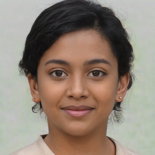 Joyful latino young-adult female with medium  black hair and brown eyes