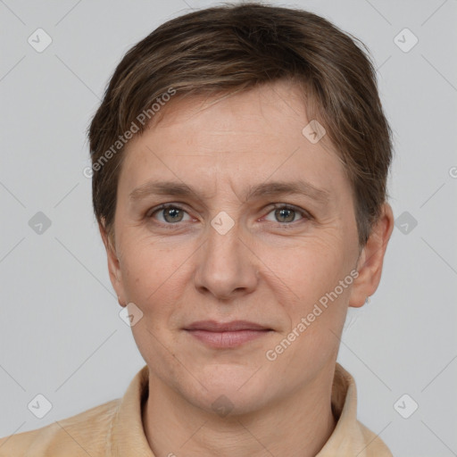 Joyful white adult female with short  brown hair and grey eyes