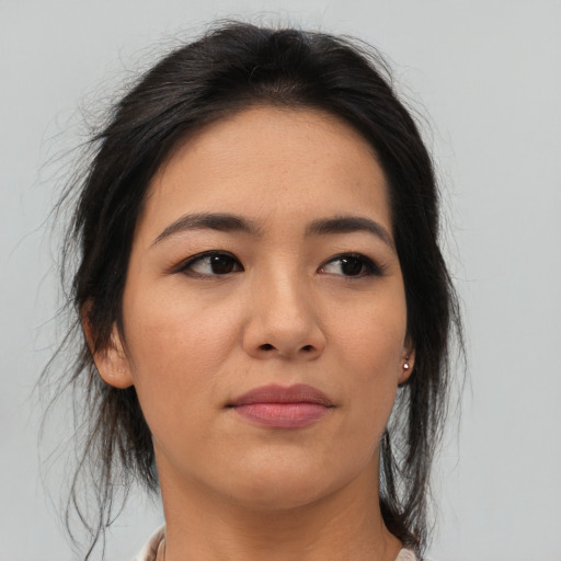 Joyful asian young-adult female with medium  brown hair and brown eyes