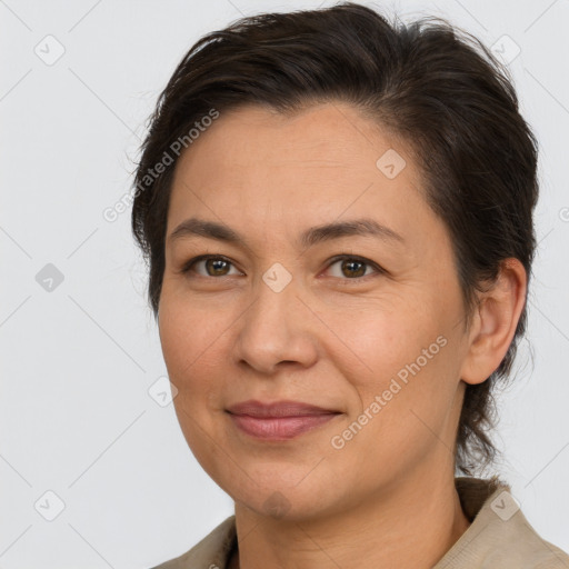 Joyful white adult female with short  brown hair and brown eyes