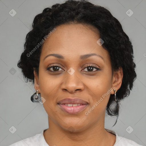 Joyful black adult female with short  brown hair and brown eyes