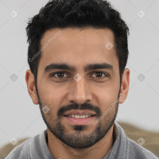 Joyful white young-adult male with short  black hair and brown eyes