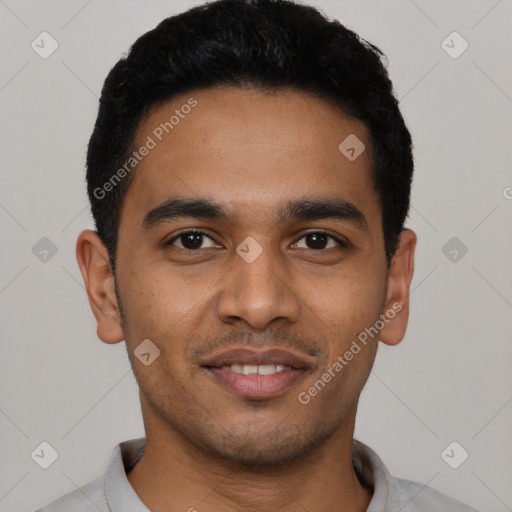 Joyful latino young-adult male with short  black hair and brown eyes