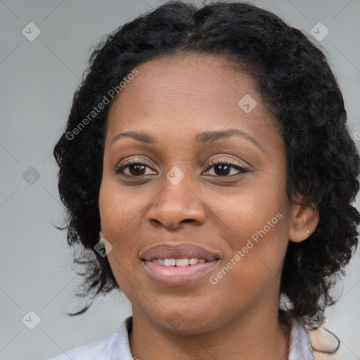 Joyful black young-adult female with medium  black hair and brown eyes