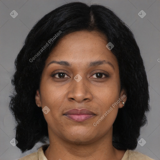 Joyful black adult female with medium  brown hair and brown eyes