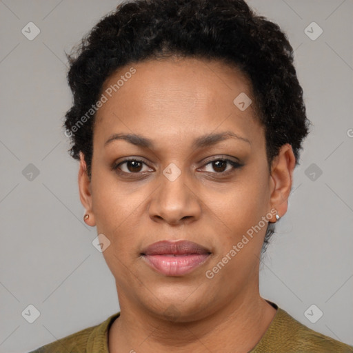 Joyful black adult female with short  black hair and brown eyes