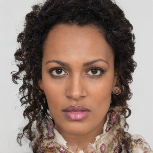 Neutral black young-adult female with long  brown hair and brown eyes