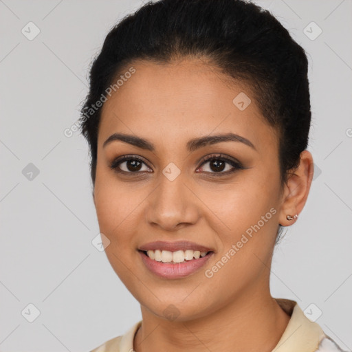 Joyful latino young-adult female with short  brown hair and brown eyes