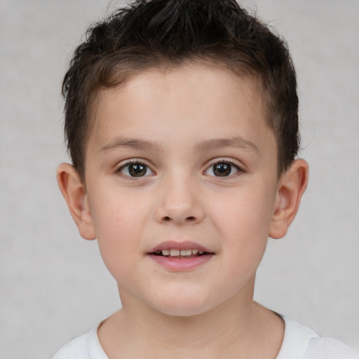 Joyful white child male with short  brown hair and brown eyes