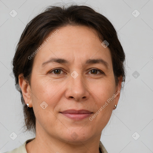 Joyful white adult female with medium  brown hair and brown eyes