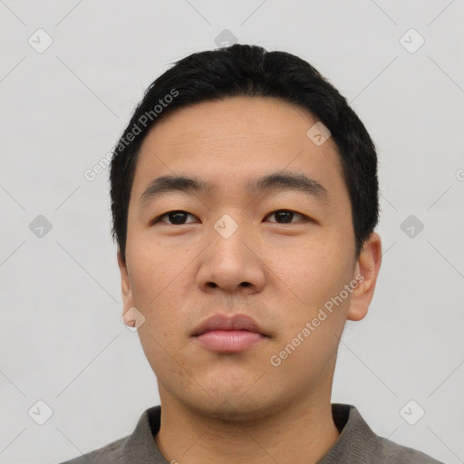 Neutral asian young-adult male with short  black hair and brown eyes