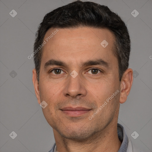 Joyful white adult male with short  brown hair and brown eyes