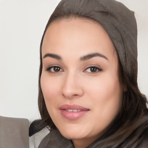 Joyful white young-adult female with long  black hair and brown eyes