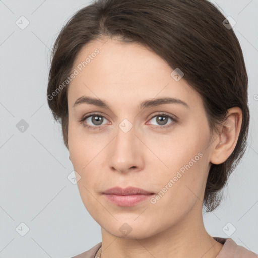 Neutral white young-adult female with medium  brown hair and brown eyes