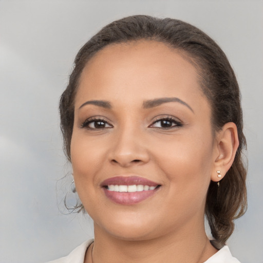 Joyful white young-adult female with medium  brown hair and brown eyes