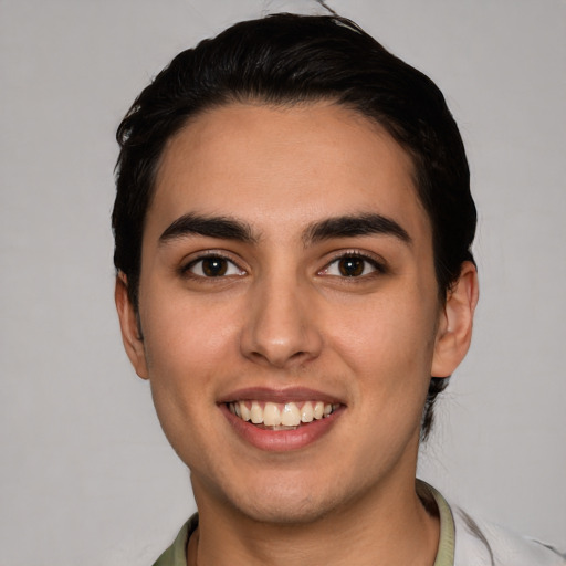 Joyful white young-adult male with short  brown hair and brown eyes