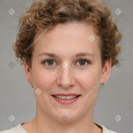 Joyful white young-adult female with short  brown hair and blue eyes