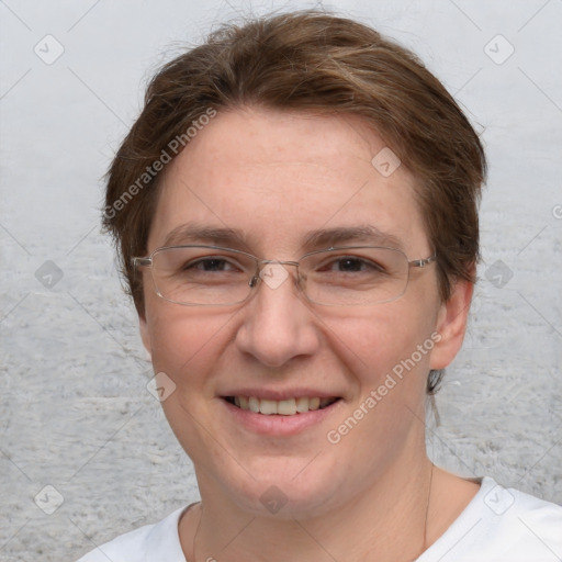 Joyful white adult female with short  brown hair and blue eyes