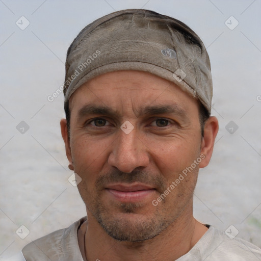 Joyful white adult male with short  black hair and brown eyes