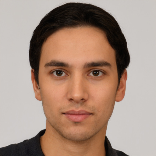 Neutral white young-adult male with short  black hair and brown eyes