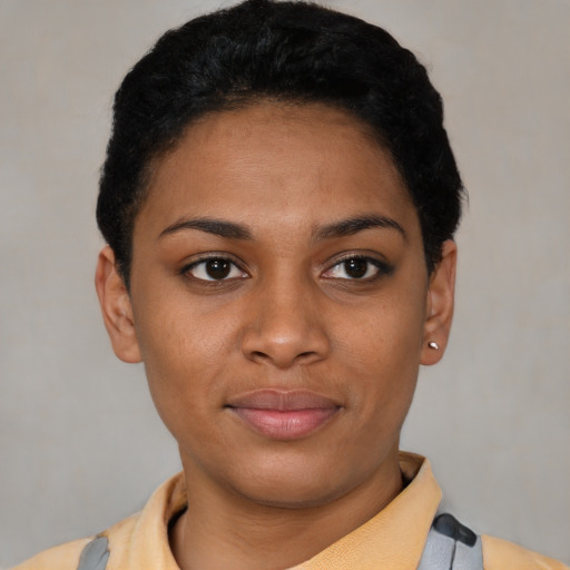 Joyful latino young-adult female with short  black hair and brown eyes