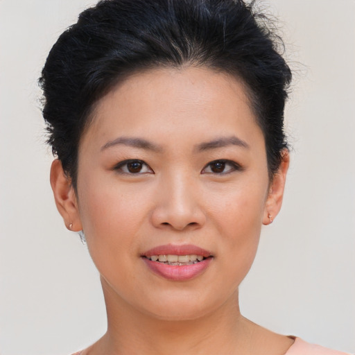 Joyful asian young-adult female with short  brown hair and brown eyes