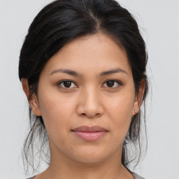 Joyful asian young-adult female with medium  brown hair and brown eyes