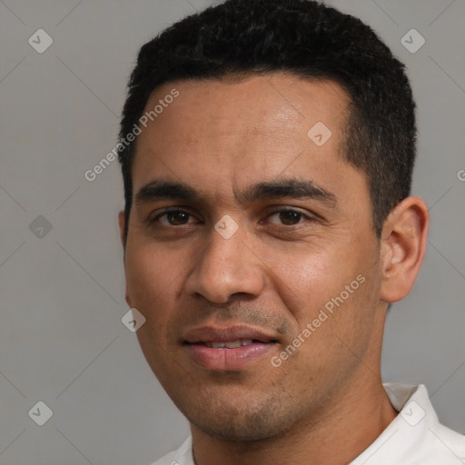 Joyful white young-adult male with short  black hair and brown eyes