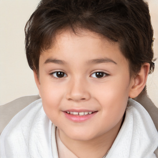 Joyful white child female with short  brown hair and brown eyes