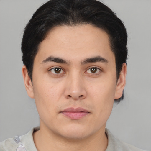 Joyful asian young-adult male with short  brown hair and brown eyes