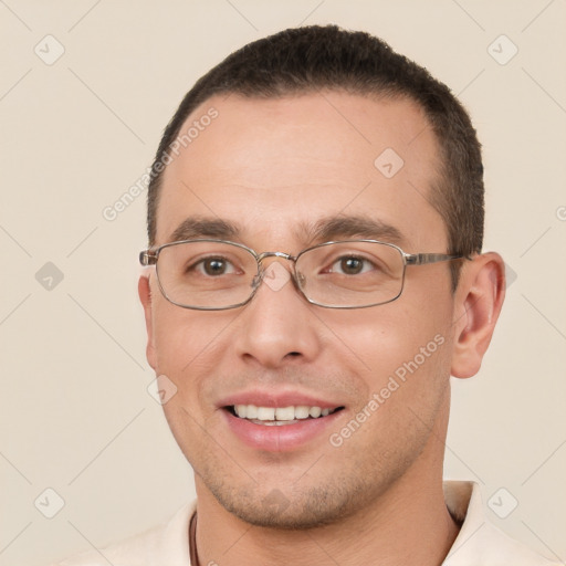 Joyful white young-adult male with short  brown hair and brown eyes