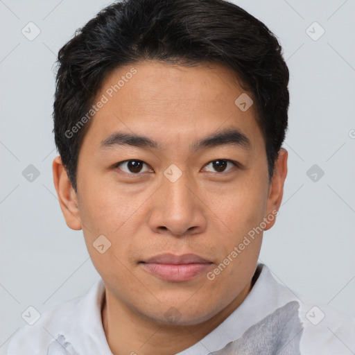 Joyful asian young-adult male with short  brown hair and brown eyes