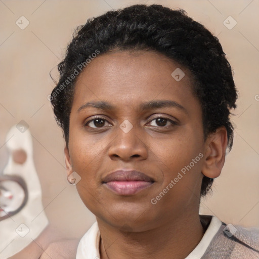 Joyful black young-adult female with short  black hair and brown eyes